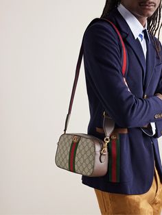 Gucci's 'Ophidia' bags have been a brand signature since they first debuted in 2018. Perfectly sized to fit your everyday essentials, this version has been crafted in Italy from monogrammed coated-canvas and detailed with striped webbing, leather trims and gold-tone 'GG' hardware. Messenger Bag For Men, Gucci Collection, Gucci Ophidia, Canvas Messenger Bag, Brown Coat, Messenger Bag Men, Gucci Accessories, Everyday Essentials, Mr Porter