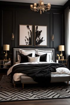 a black and white bedroom with chandelier above the bed, two paintings on the wall