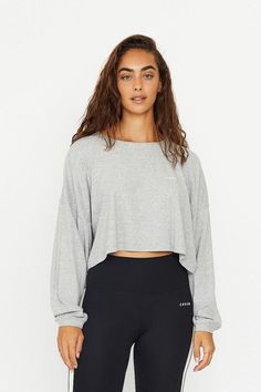 Product Details A statement oversized long-sleeve crop top, crafted from exceptionally soft small-ribbed modal fabric. This trendy piece features slouchy long sleeves, a casual crew neck, drop shoulder, and an oversized fit. Small contrasting logo on the chest. Ideal for effortless off-duty layering or wearing solo. Materials & Care Composition: 92% Modal, 8% Spandex Machine wash cold with like colors, do not bleach. wash inside out. Do not dry clean. Model is wearing size S. For more info pleas Modal Fabric, Bleach Wash, Long Sleeve Crop, New Wardrobe, Off Duty, Long Sleeve Crop Top, Heather Gray, Drop Shoulder, Heather Grey