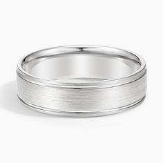 a white gold wedding ring on a white background