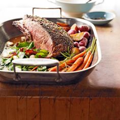 a roasting pan filled with meat and vegetables