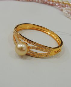 1971 Formal Pearl Bracelet With Pearl Pendant, Round Pearl Bracelet With Oyster Design For Anniversary, Anniversary Pearl Bangle Bracelet, Formal Beaded Pearl Bangle Bracelet, High Luster Pearl Bracelet Gift, Formal Round Pearl Bracelet, Pearl Bangle As Gift, Pearl Wedding Bracelet With 17 Jewels, Formal Gold Pearl Bracelet With Oyster Design