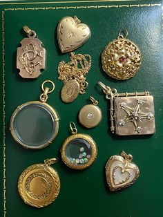 "A collection of beautiful antique and vintage lockets in solid yellow gold - ready for you to add your own photos and memories! Sold individually. 1. 14k bell-shaped locket, with ruby. Opens from the bottom. Engine-turned interior, florentine details on exterior. 6.78g, 1\"X 1\". 2. 14k heart locket, with etched decoration and star-set diamond. Matte finish. 3.95g, 1\" x 0.75\". 3. 14k heart locket with mother of pearl inlay, ca. 1930. 3.53g, 1\" x 0.75\". [SOLD OUT] 4. 18k antique Victorian ci Affordable Traditional Locket Jewelry, Luxury Heirloom Jewelry Hallmarked, Luxury Antique Jewelry For Vintage Events, Luxury Vintage Heirloom Jewelry, Cheap Sentimental Locket Jewelry, Luxury Antique Necklaces For Gift, Luxury Antique Jewelry For Memorial, Luxury Traditional Locket Jewelry, Cheap Antique Jewelry