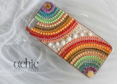 a cell phone case with beaded designs on it