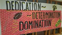 there is a sign on the wall that says dedication to the determinations of democracy