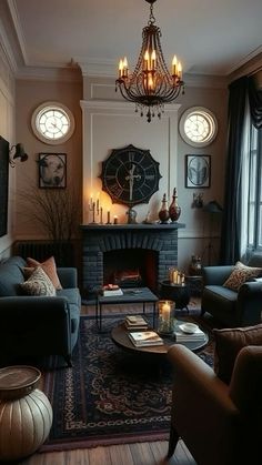 a living room filled with furniture and a chandelier hanging from the ceiling over a fire place