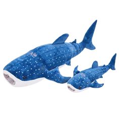 two blue stuffed sharks with white spots on them