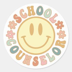 a round sticker with the words school house on it and an image of a smiley face