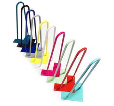 five different colored umbrellas are lined up in a row on a white background,