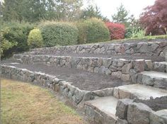 a stone wall with steps made out of rocks