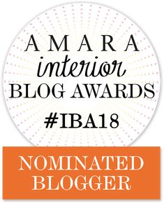 an orange and white circle with the words nominated in it's top 10 blog awards