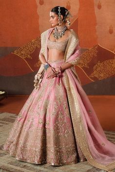 Onion pink lehenga featuring zardozi embroidered amaltas, sehri, floral motifs and beri bel motif border, embellished with sitara. Comes with separate can can, embroidered blouse and broad border shoulder dupatta. - Aza Fashions Pink Tilla Dupatta, Pink Sharara With Tilla And Traditional Drape, Pink Sharara With Tilla In Traditional Drape, Pink Sharara With Tilla Embroidery, Pink Tilla Sets For Diwali, Diwali Pink Tilla Sets, Semi-stitched Pink Lehenga With Tilla Details, Pink Semi-stitched Lehenga With Tilla, Pink Tilla Dupatta For Wedding