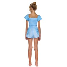 Little Peixoto Enzo short set in Sky Blue Prairie. Top features smocked bodice with eyelet puff sleeves with elastic cuffs. Shorts have a smocked waist with eyelet slant pockets. Cotton. Size Conversion: (XS = 2/4), (S = 6/8), (M = 10/12), (L = 14). Blue Gathered Waist Bottoms For Summer, Blue Bottoms With Gathered Waist For Summer, Fitted Casual Smocked Top With Elastic Waistband, Casual Fitted Smocked Top With Elastic Waistband, Casual Smocked Top With Elastic Waistband, Casual Smocked Top With Short Sleeves And Elastic Waistband, Blue Summer Top With Elastic Sleeves, Summer Smocked Puff Sleeve Top, Blue Smocked Puff Sleeve Top For Summer