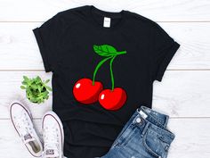 Cherry Shirt, Cherries Shirt, Red Cherry Lover Shirt, Sweet Cherry Gift, Summer Fruit Shirt, Cherries Gift, Cherry Fruit Gift, Unisex Shirt All our shirts are custom made and we are excited to print the shirt for you! This tee feels soft and lightweight, with the right amount of stretch. It's comfortable and flattering for both men and women. * 100% ring-spun cotton * Sport Grey is 90% ring-spun cotton, 10% polyester * Dark Heather is 65% polyester, 35% cotton * 4.5 oz/y² (153 g/m²) * Pre-shrunk Casual Red Cherry Print Tops, Casual Cherry Short Sleeve Tops, Red Cherry Print Short Sleeve Top, Red Cotton T-shirt With Cherry Print, Red Cherry Print Crew Neck T-shirt, Red T-shirt For Summer Gift, Red Graphic Print Top As Gift, Red Graphic Print Shirt For Gift, Red Graphic Print Shirt As Gift