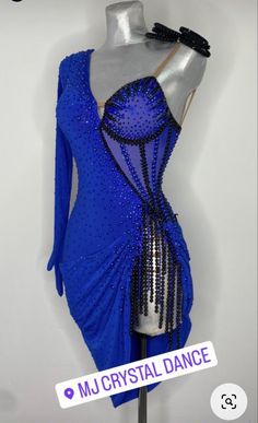 a blue dress with sequins on it