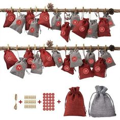 several bags are hanging on a clothes line with buttons and pins attached to them, along with other items