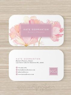 two business cards with watercolor flowers on them, one is pink and the other is white