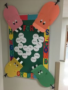 a bulletin board with paper cutouts on it