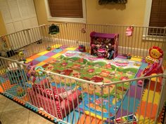 a child's playpen with stuffed animals and toys on the floor in it