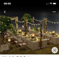 an image of a table set up with candles and greenery for a wedding reception