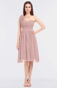 a woman in a short bridesmaid dress