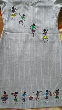 a child's dress with stick figures on it