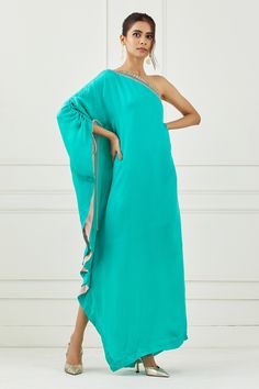 Teal one shoulder dress with hand embroidered neckline and one side flared sleeve.
Component: 1
Pattern: Embroidered
Type Of Work: Sequin
Neckline: Asymmetric
Sleeve Type: Asymmetric
Fabric: Satin
Color: Green
Other Details: 
One side gathered sleeve
Asymmetric silhouette
Occasion: Resort - Aza Fashions Teal Green Dress, Dress Label, Indian Culture, Gathered Sleeves, Embroidered Neckline, Satin Color, Green Satin, Teal Green, Festival Wear