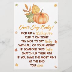 an autumn baby announcement card with pumpkins and leaves on the front, which reads don't say baby pick up a clothes pin