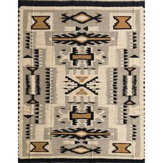 an old navajo rug with black, white and brown designs on the front end is shown