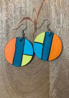 wooden earrings with multicolored shapes on them