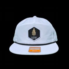 I don't know about you, but I'm always stuck in the pines. Punch it back to the fairway with this clean, classic look. Richardson Rope Hat with woven label. 85% Cotton, 15% Nylon Adjustable Snapback OSFM White Snapback Hat For Camping, White Snapback Baseball Cap, White Snapback Hat With Flat Brim For Outdoor Activities, Casual White Hat For Camping, White Six-panel Snapback Hat For Outdoor Activities, Casual Snapback Hat With Flat Bill For Golf, Casual Flat Bill Snapback Hat For Golf, White Baseball Cap For Hiking, White Outdoor Hat With Logo Patch