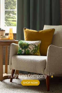 a living room with a chair, table and window