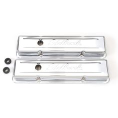 two chrome plated valve covers for the front and back of a car