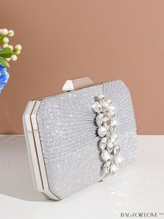 BagForLove - Deluxe Wedding Clutch with Diamond-styled Decoration - Versatile and Elegant Evening Bag Product Description Color Silver Details Rhinestone Magnetic No Strap Type Chain Bag Size Mini Style Glamorous Pattern Type Plain Type Square Bag Closure Type Kiss Lock Material Glitter Composition 100% Polyester Care Instructions Do not wash Size Chart INCH CM Bag Height Bag Length Bag Width Strap Length 4.7 inch 7.9 inch 2.2 inch 47.2 inch Bag Height Bag Length Bag Width Strap Length 12 cm 20 cm 5.5 cm 120 cm Details Pictures Similar Products h2 { text-align: center; } /* æ¢è¡ */ li{ white-space: normal; word-break: break-all; word-wrap: break-word; } .red-box { width: 100%; display: flex; flex-direction: row; flex-wrap: wrap; justify-content: center; } .red-box > div { width: 190px; h Silver Handheld Shoulder Bag For Wedding, Rectangular Rhinestone Shoulder Bag For Weddings, Rectangular Rhinestone Bags For Wedding Guests, Silver Rhinestone Shoulder Bag For Wedding, Silver Clutch Shoulder Bag For Wedding, Silver Wedding Clutch Shoulder Bag, Silver Rectangular Shoulder Bag For Wedding, Rectangular Wedding Bags With Rhinestones, Silver Clutch Bag For Wedding Guest