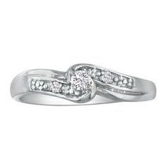 a white gold ring with two diamonds on it's sides and the center diamond in the middle