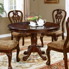 a dining room table with chairs around it