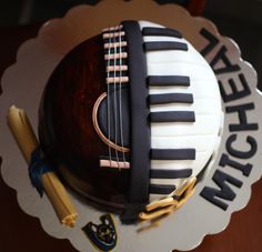 a cake that is shaped like a musical instrument