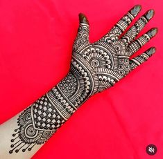 a henna tattoo on someone's hand