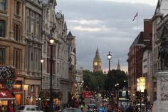 a busy city street with cars and people on it