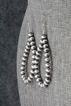 These sterling silver bead earrings were made by Navajo silversmith Louise Joe.Length: 2 5/8"Width: 1 1/4"Bead Size: 3/16"Free shipping on all orders! We ship with USPS and always include tracking. All orders ship within a day of payment.Returns are accepted up to 30 days after you receive your order. Just send us a message. Our shop offers cash back or store credit. The item must be returned in new condition. Silver Bead Earrings, Silver Bead, Bead Earrings, Native American Jewelry, Sterling Silver Bead, Free Jewelry, Silver Beads, Beaded Earrings, Sterling Silver