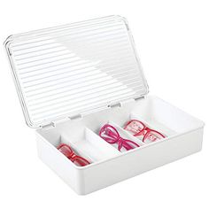 two pairs of pink glasses in a white box with dividers on the bottom and inside