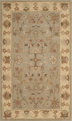 an area rug with various colors and designs on the carpet, including beiges, browns, and tans