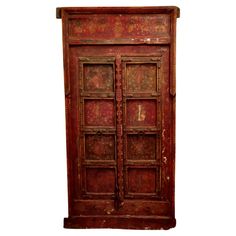 an old wooden door with ornate carvings on the front and side panels, isolated against a white background