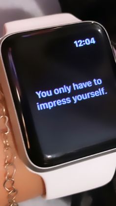 an apple watch with the message you only have to impress yourself