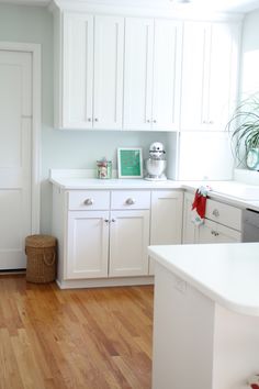 the kitchen is clean and ready for us to use it's white cabinetry