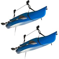 two blue kayaks with oars attached to the front and back of each boat