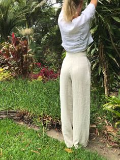 "LINEN HIGH WAISTED STRAIGHT LEG TROUSERS - CUSTOM ITEM** High waisted vintage style trousers. Tailored at the waist, pleated at the front, two pockets at the hips, and darts at the back of the waist for a defined fit. Pocket opening button and press stud closure. Wide/straight leg finishing below the ankle. Tailored to your height FARGELAND is an independent, female-owned business. All of my clothing is designed and handmade by me in my art studio in Bulli, Australia. Just south of Sydney. When Pants Custom, Fashion Minimal, Fashion Minimalist, Style Trousers, Straight Leg Trousers, How To Slim Down, Black Linen, High Waisted Trousers, Minimal Fashion