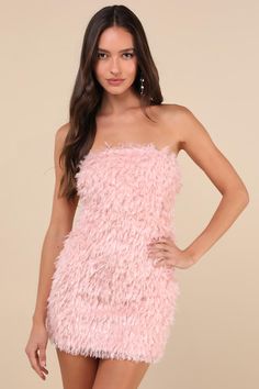 A night of flawless moments begins with the Lulus Glam Instinct Light Pink Fringe Strapless Bodycon Mini Dress! Soft feather-like fringe, paired with shiny clear tinsel-like threading, covers knit fabric as it shapes a straight neckline (with hidden no-slip strips) and a strapless bodice. The figure-flaunting silhouette continues into a bodycon skirt that finishes at a flirty mini hem. Hidden side zipper/clasp. Fit: This garment fits true to size. Length: Mid-thigh. Size medium measures 25.38" f Sparkly Fringe Dress, Light Pink Mini Dress, Mini Bodycon Dress, Bodycon Skirt, Straight Neckline, Fringe Dress, Body Con Skirt, Pink Mini Dresses, Bodycon Mini Dress