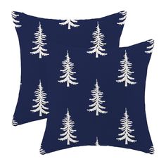 two blue pillows with white trees on them