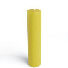 a yellow pillar candle on a white background